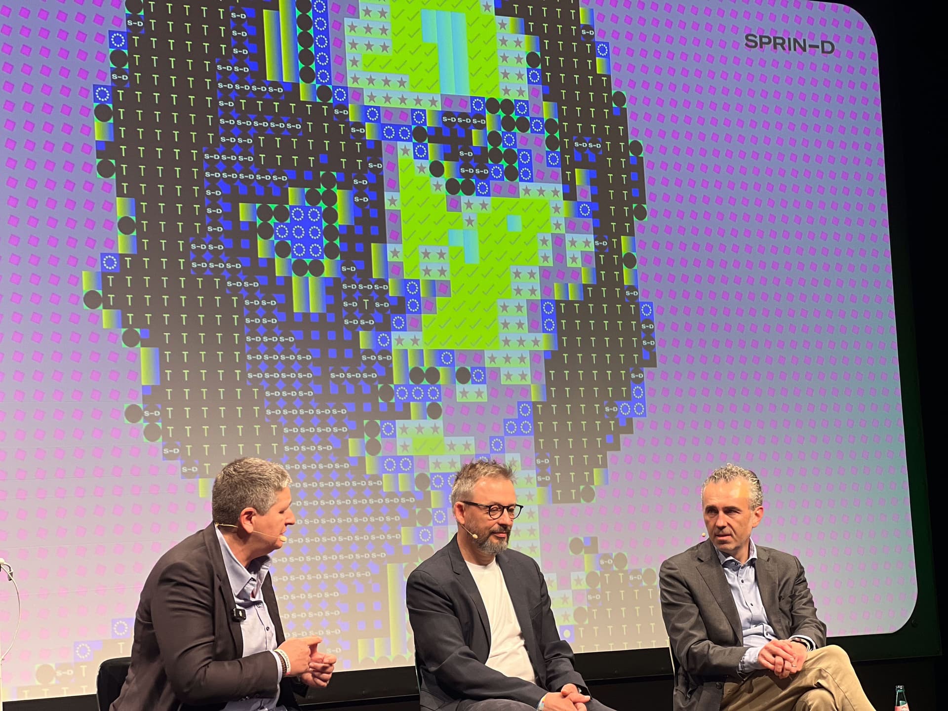 Speaker with Identity Mirror Keyvisual on stage