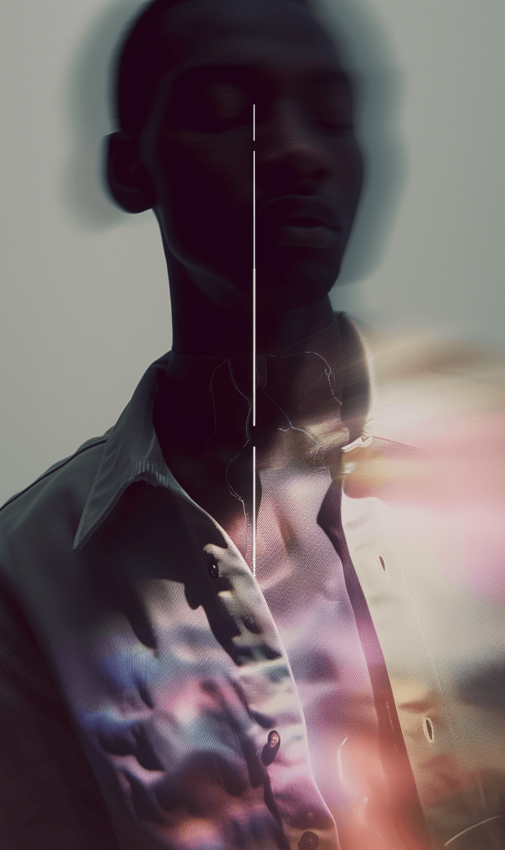 Motion-blurred black-and-white portrait with warm light flares