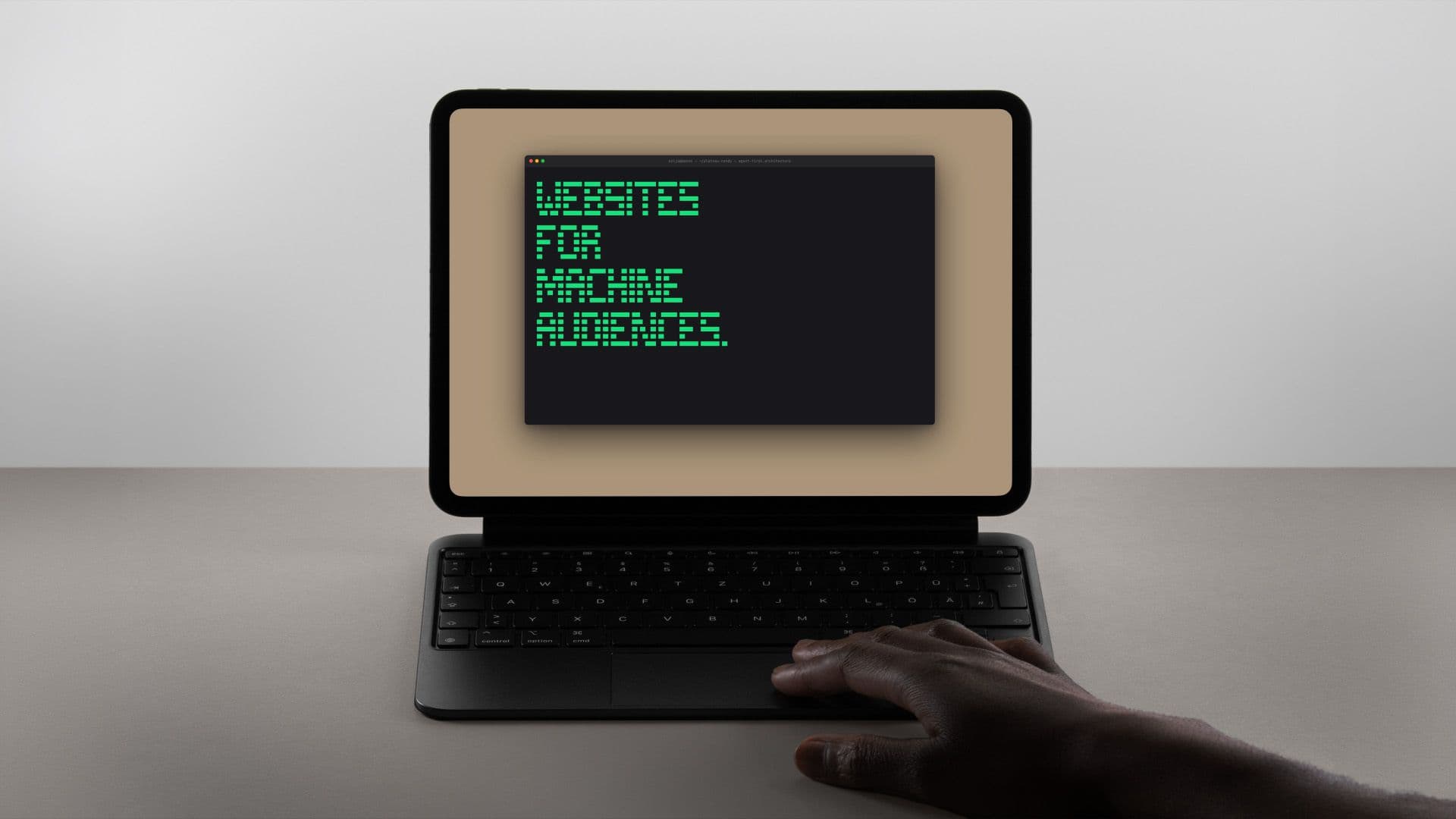 Laptop showing CLI stating "WEBSITES FOR MACHINE AUDIENCES"